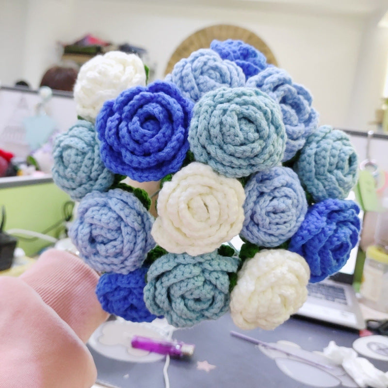Waterfall bride holds a knitted bouquet of flowers to knit wedding gifts